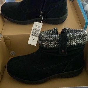 New and unused black boots with black n white fuzz on top